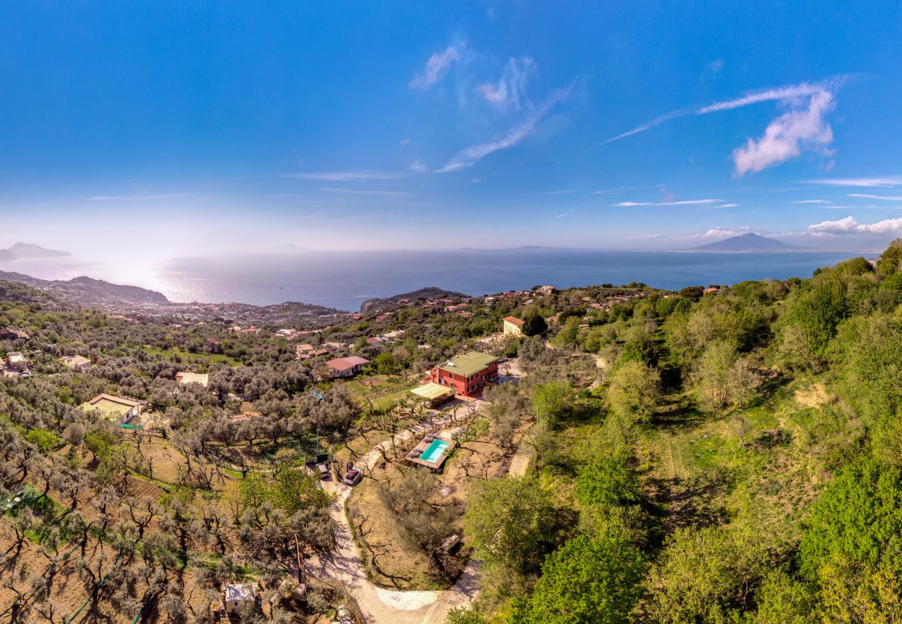 vacation villa with pool and view overlooking capri island and amalfi coast, drone photo