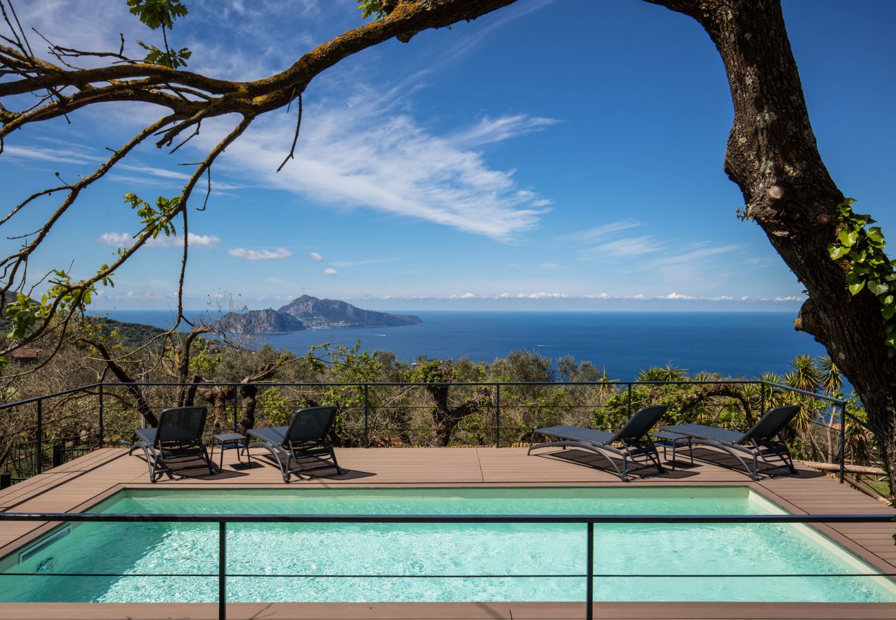 panoramic views overlooking capri island and the amalfi coast, from the pool side